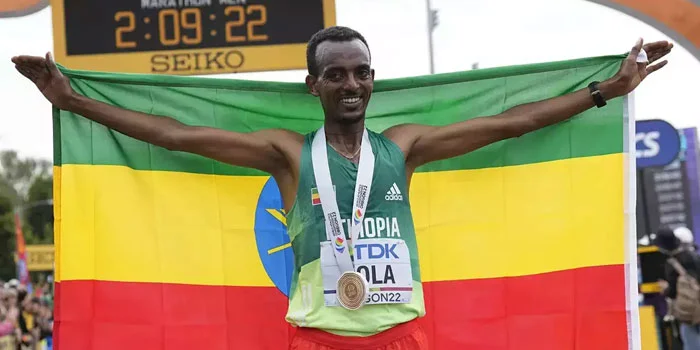 Tamirat Tola – Atlet Ethiopia Mengklaim Medali Emas Maraton Melalui Jalur Yang Penuh Liku